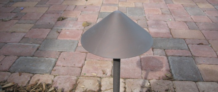 Low Voltage Lighting Installed Along Paver Patio in Eagan Low Voltage Hood Lamp