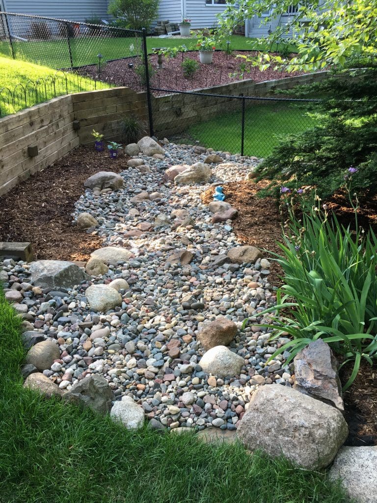 Dry Stream River Bed Installation in Rosemount Pahl's Market Apple