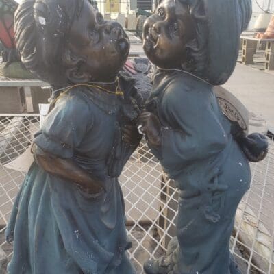 Boy Girl Kissing Statue